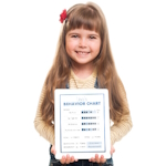 Girl holding a behavior chart